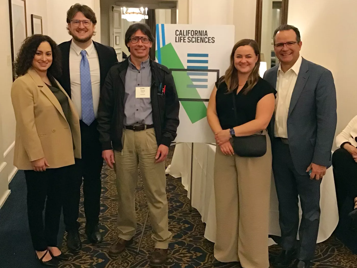 David Sanker, Sepeedeh Moin, John Parviainen, Emily Morgan, and Mike Guerra together in front of a CLS sign at the JPM Annual Health Conference.
