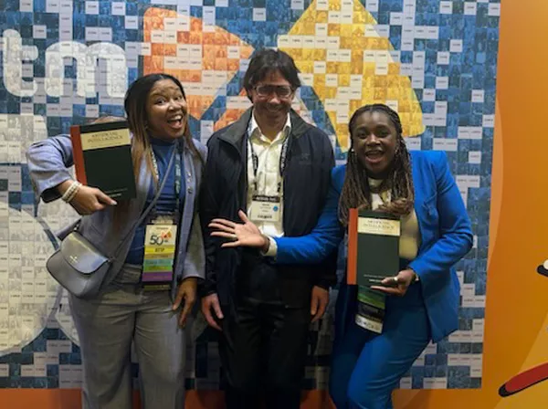 David Sanker posing with AUTM attendees.