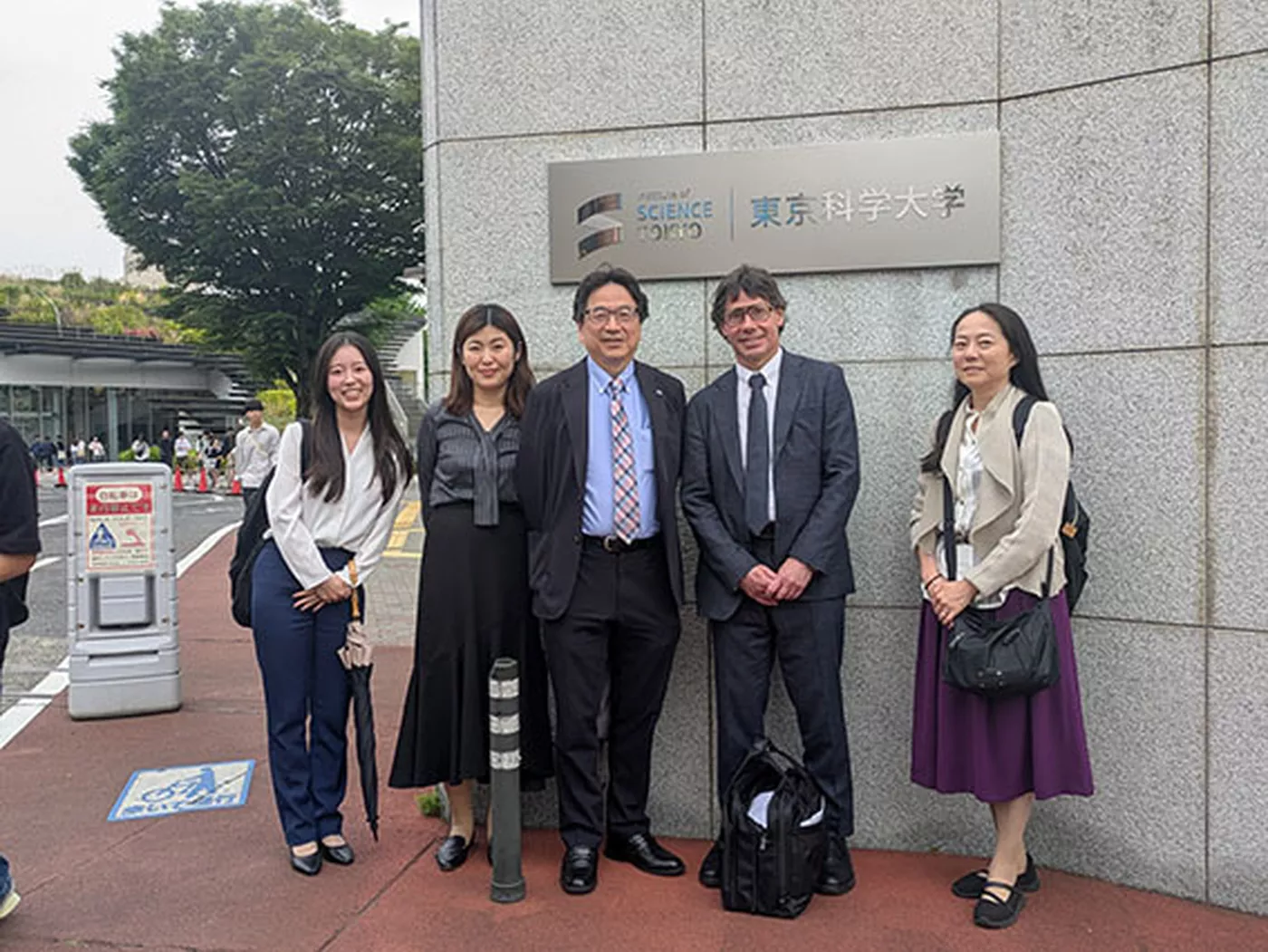 David Sanker posing together with Professor Oshima and colleagues.